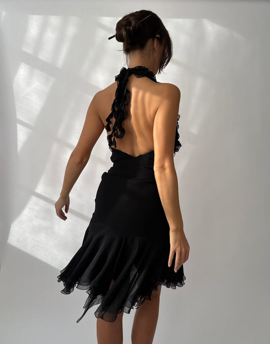 Back view of the Versace 2004 asymmetric silk ruffled dress showing plunging neckline and draped hem.