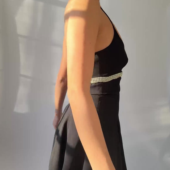 A video of a model showcasing the Dolce  Gabbana spring summer 1995 dress while spinning in a circle. 