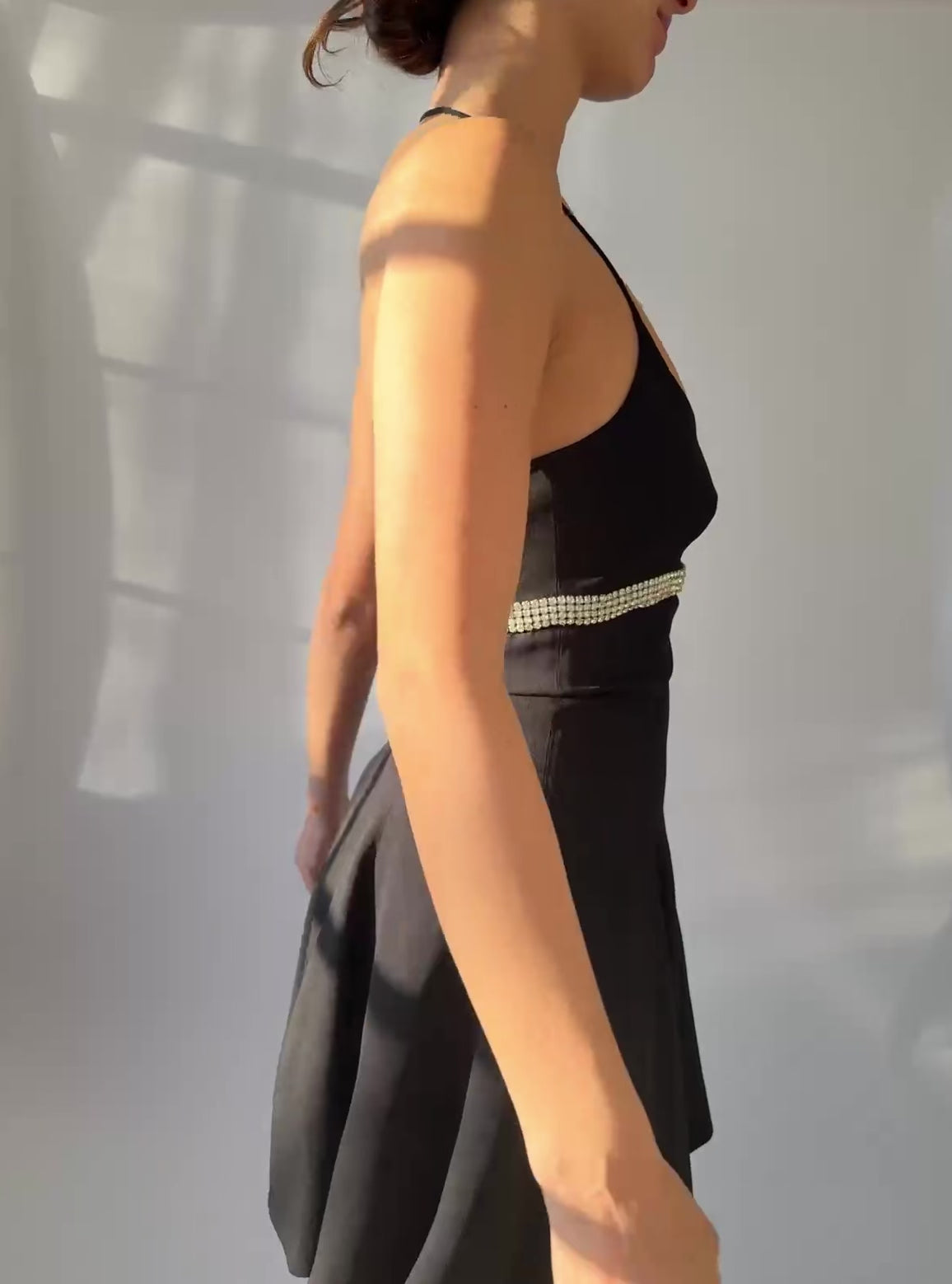 A video of a model showcasing the Dolce  Gabbana spring summer 1995 dress while spinning in a circle. 